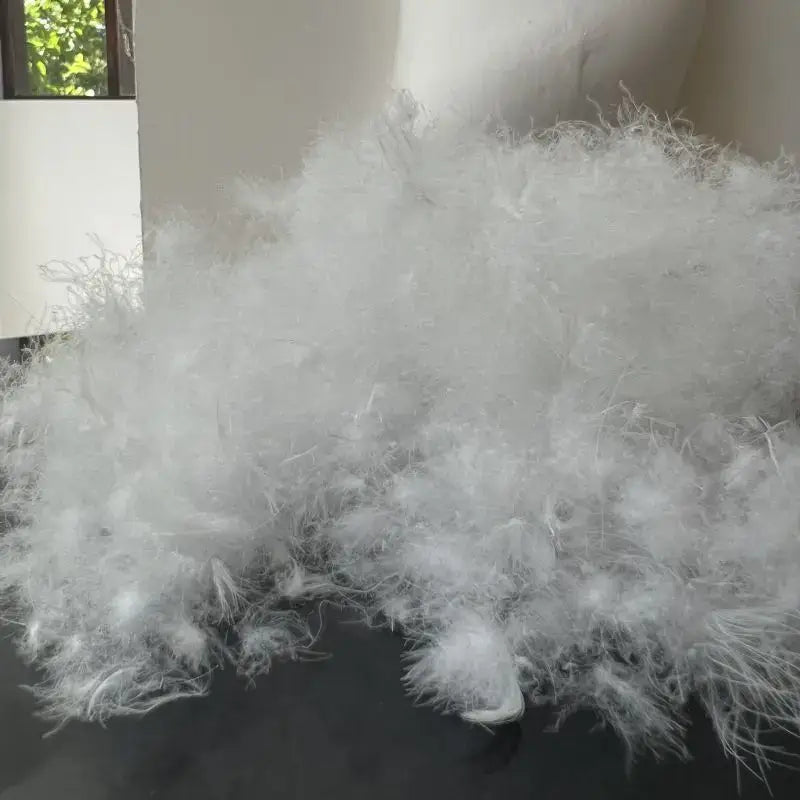 A soft, voluminous pile of fluffy white feathers for decorbites luxe goose down winter duvet queen king size comforter core