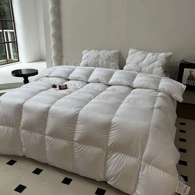 White quilted down comforter with plush texture and subtle ribbing from decorbites luxe goose winter duvet