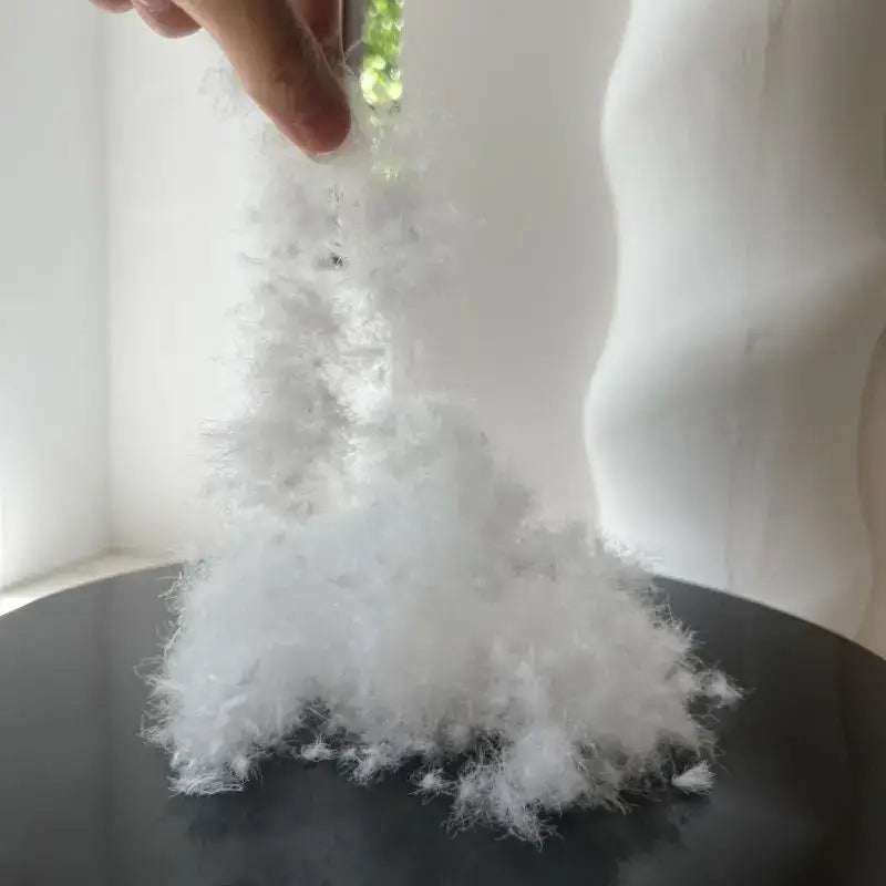 A fluffy white synthetic fiber pile resembling soft feathery texture in decorbites luxe goose down quilt core