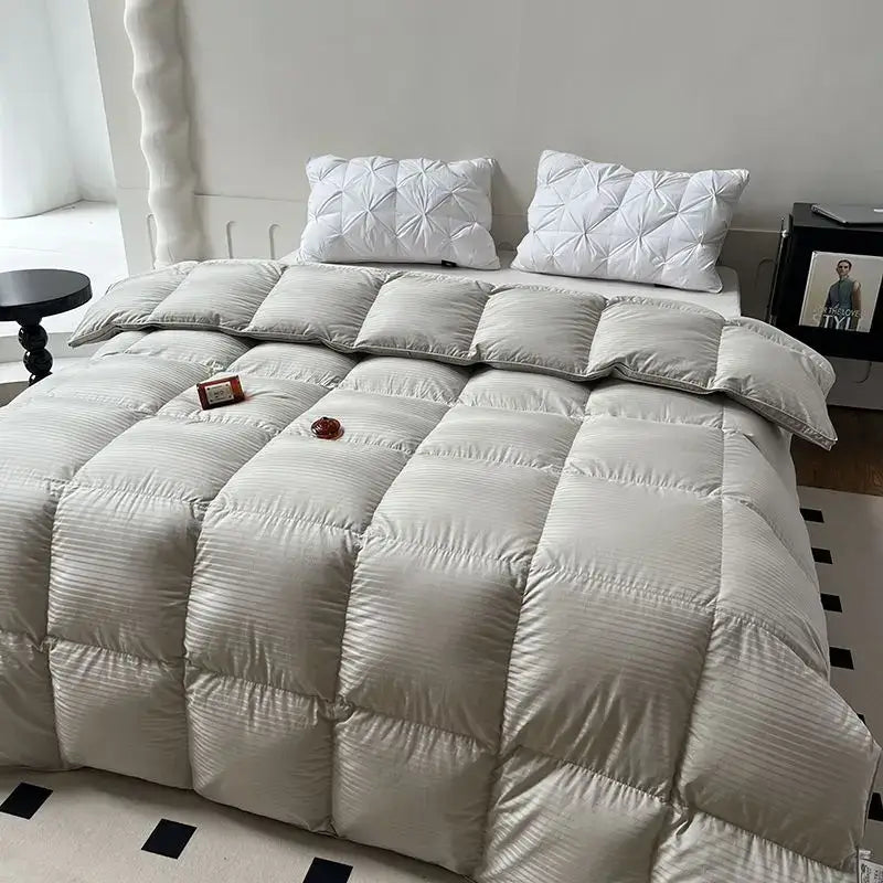 A plush light gray quilt with ribbed texture and square stitching in the DecorBites Luxe Goose down duvet core