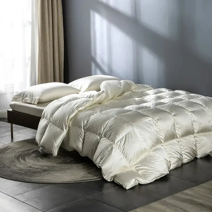 Cream-colored decorbites luxe goose duck down quilt with subtle embroidery and diamond stitching for cozy warmth