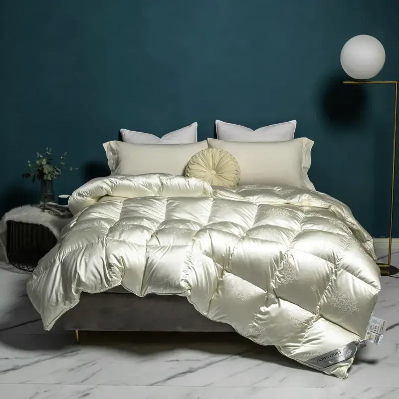Cream-colored satin quilt with subtle embroidery and plush texture in decorbites luxe goose duck down queen king size