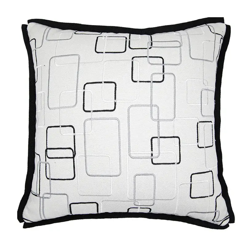 White square decorbites luxe hotel pillowcase with black and gray embroidered geometric patterns and solid black border
