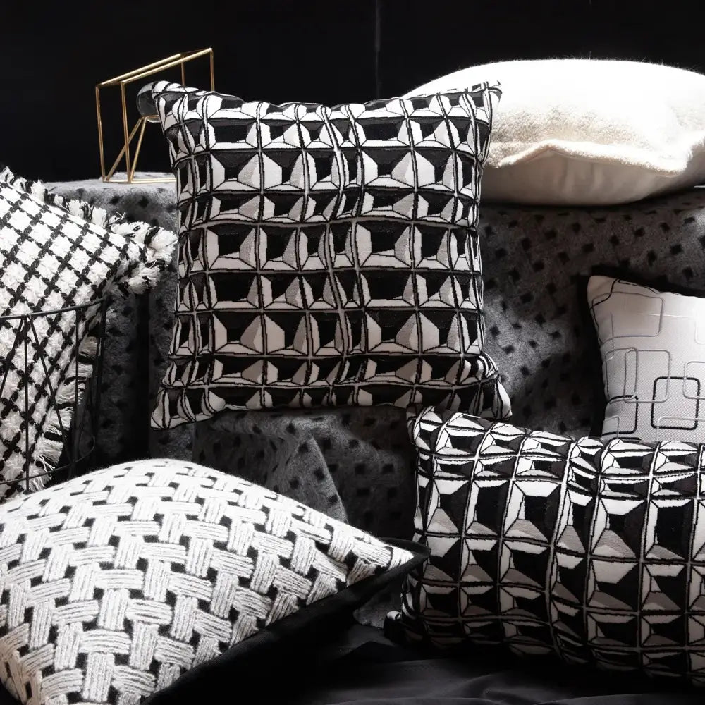 Black and white geometric patterned throw pillow with textured embroidered design from decorbites luxe hotel pillowcases collection