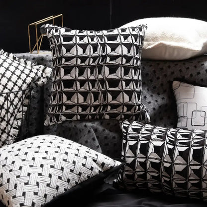 Black and white geometric patterned throw pillow with textured embroidered design from decorbites luxe hotel pillowcases collection
