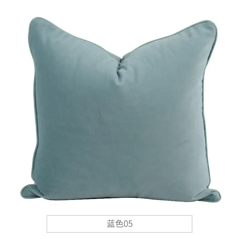 A soft square decorbites luxe italy velvet pillowslip in muted teal blue with stitched edges for living room sofa