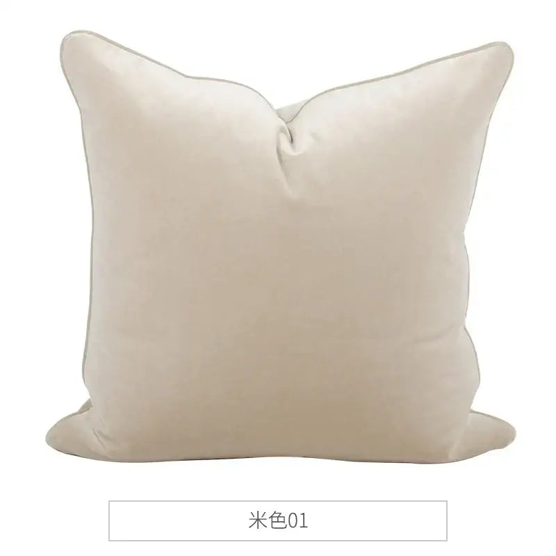 Cream-colored decorbites luxe italy velvet pillowslip with plush velvet texture and stitched trim for living room sofa