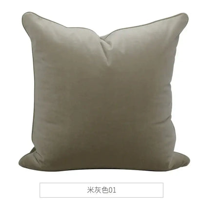 A soft beige decorbites luxe italy cushion case with plush velvet texture and stitched edges for living room sofa
