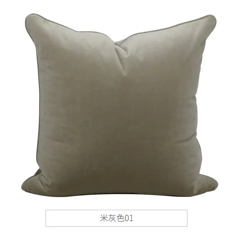 A soft beige decorbites luxe italy cushion case with plush velvet texture and stitched edges for living room sofa