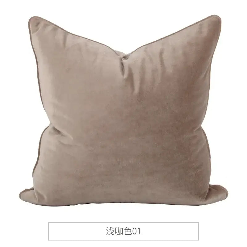 A plush taupe square cushion with neatly stitched edges in decorbites luxe italy velvet pillowslip for sofa use