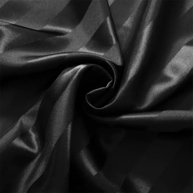 Black satin DecorBites™ luxe jacquard stripes pillow cover set with smooth glossy finish and flowing folds for queen and king size pillows