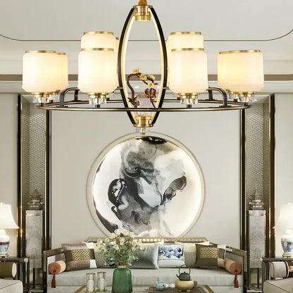 Gold-toned decorbites luxe jade chandelier with six frosted glass shades and central decorative element for living rooms