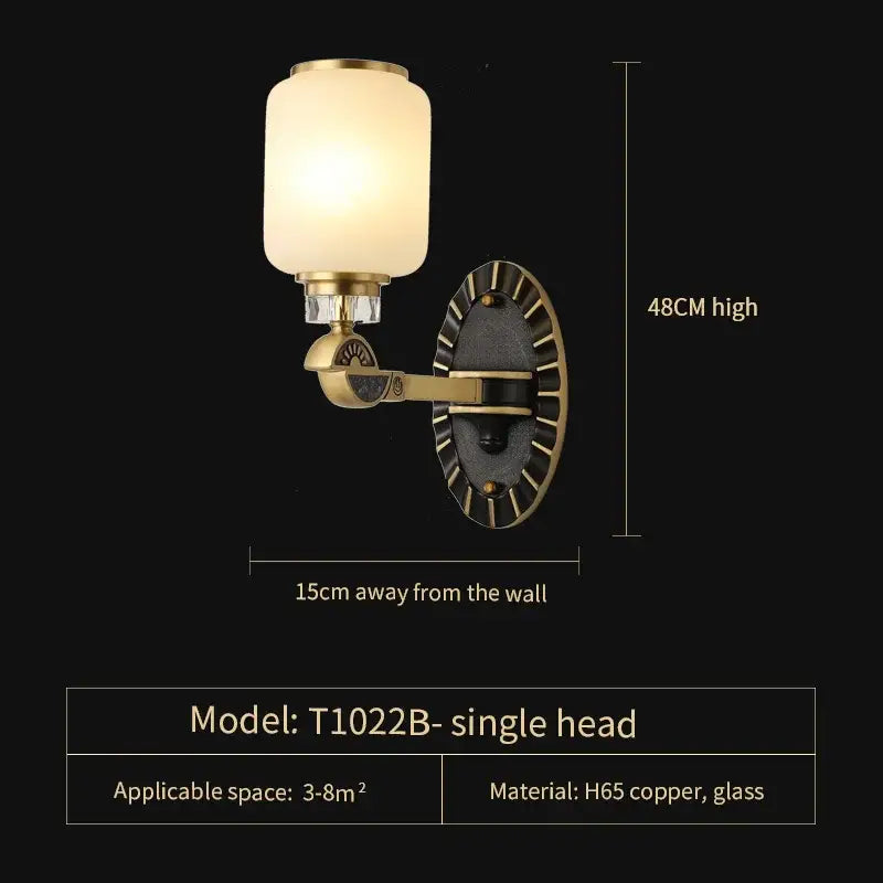 Antique brass-finished wall sconce with frosted glass shade and decorative clock face for decorbites luxe jade chandelier