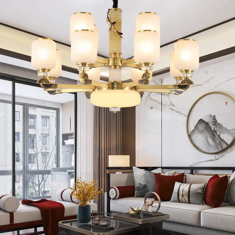 DecorBites Luxe Jade chandelier brass finished with frosted glass shades and ornate detailing for living room use