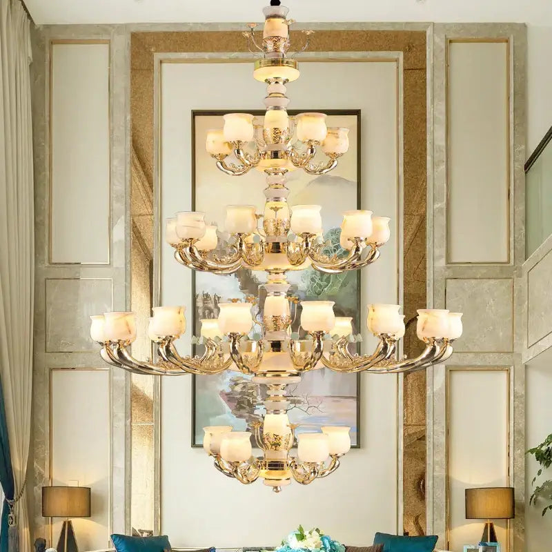 Multi-tiered living room chandelier with gold-toned metal frame and frosted glass shades decorbites luxe jade copper design