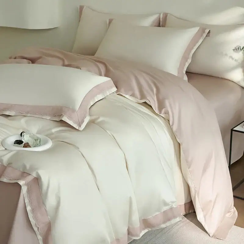 Cream-colored satin duvet set with soft pink lace-trimmed edges and matching pillowcases from decorbites luxe lace bedding set