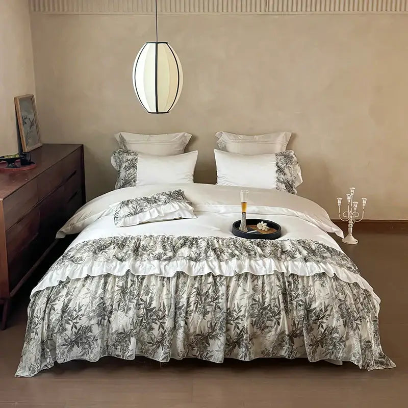 Elegant white and gray botanical print ruffled bed skirt with layered frills in decorbites luxe lace ruffles bedding set