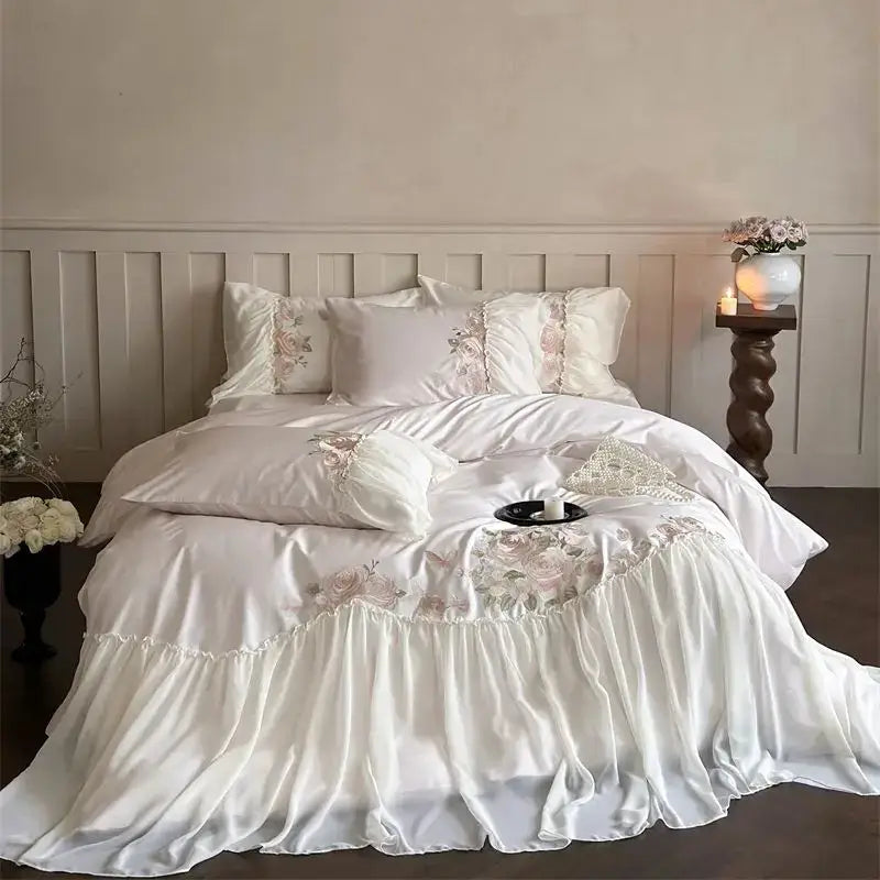 Elegant ivory satin bedding set with delicate floral embroidery and ruffled hem by DecorBites™ luxe lace ruffles