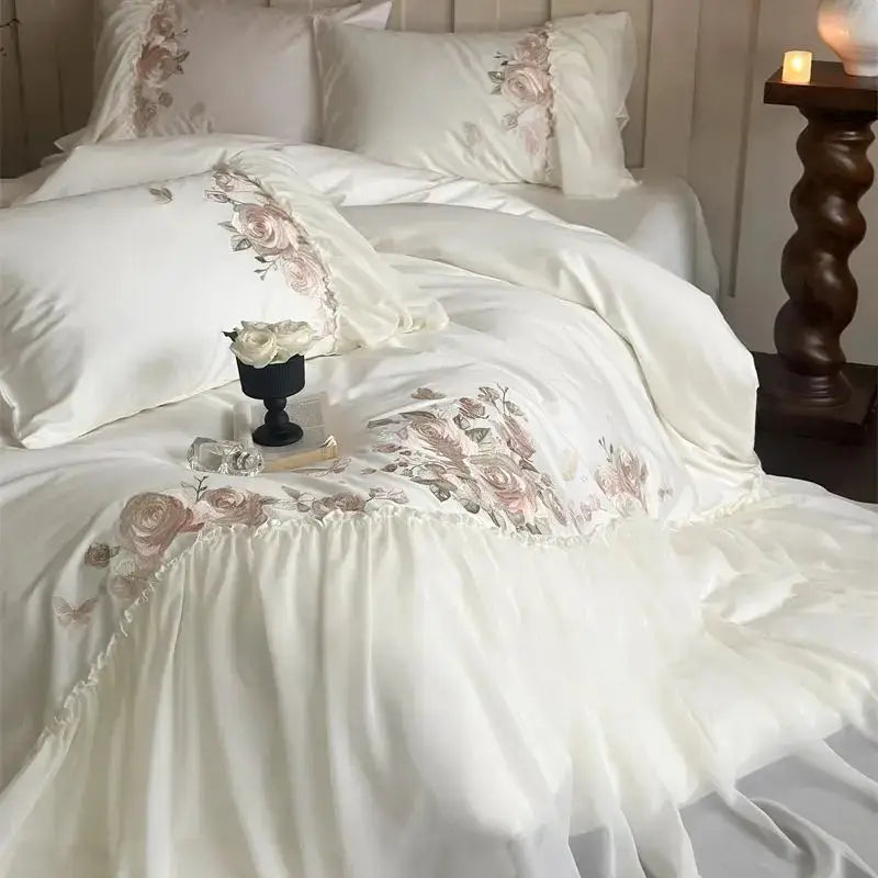 Decorbites luxe lace white satin bedding set with blush pink floral embroidery and ruffled edges for elegant decor