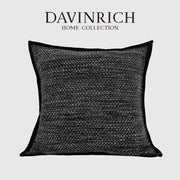 Black textured throw pillow with woven fabric and contrasting trim from decorbites luxe linen blend cushion covers set