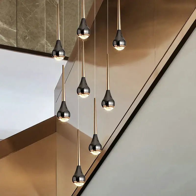 Modern black and gold decorbites luxe loft chandelier with teardrop glass shades for living room or hotel use