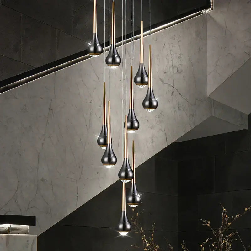 Modern black and gold teardrop pendant lights in decorbites luxe loft chandelier for living room or hotel interiors