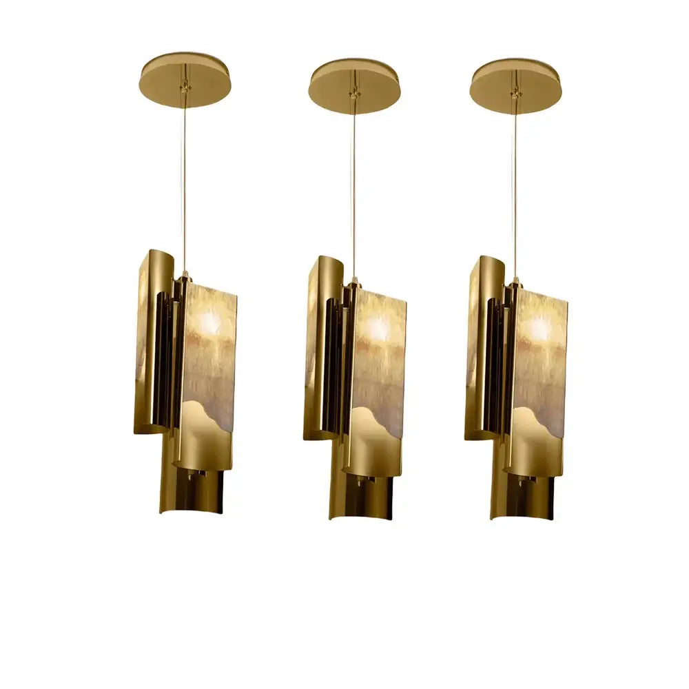 Three modern brass pendant lights with textured glass shades from decorbites luxe marble pendant light collection
