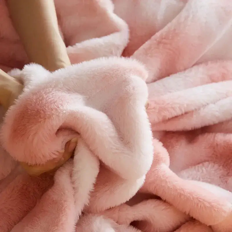 Soft pink and white plush decorbites luxe milk velvet blanket with thick cozy faux fur texture for home and office use