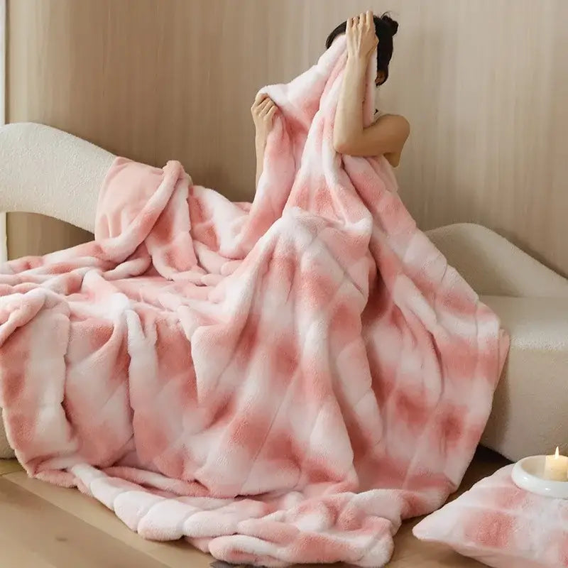 A plush decorbites luxe milk velvet blanket in gradient pink and white with a soft fuzzy texture for home and office use