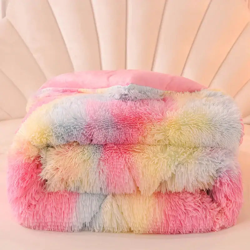 A decorbites luxe mink fleece patchwork quilt featuring a soft, plush rainbow-colored fleece with pastel stripes
