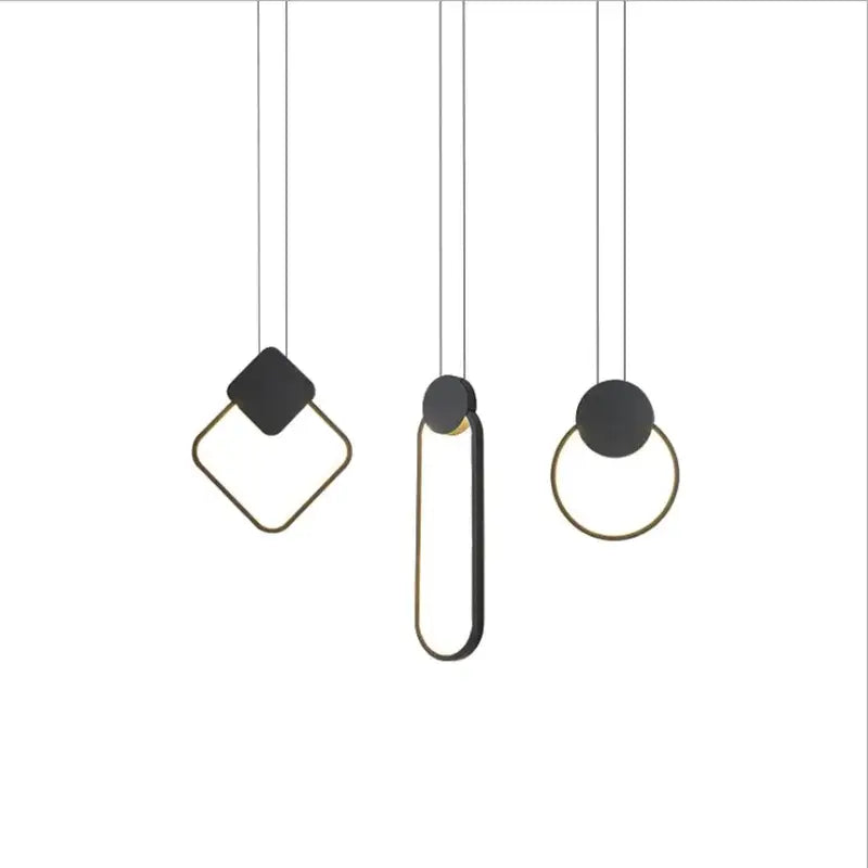 Set of three matte black and gold pendant light fixtures with geometric shapes in the decorbites luxe nordic circle lamp collection