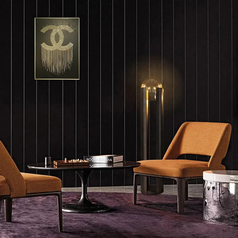 Orange upholstered armchair with dark metal frame beside decorbites luxe nordic led floor lamp for stylish living spaces