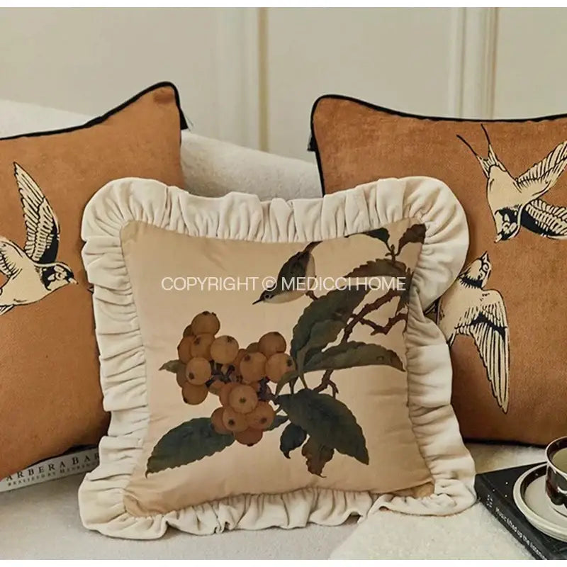 Beige decorative pillow case with cream ruffled trim and printed botanical berry and leaf design for sofa bed