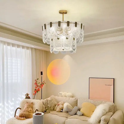 A modern decorbites luxe palace ceiling chandelier with tiered gold fixture and clear glass fan-shaped shades for elegant lighting