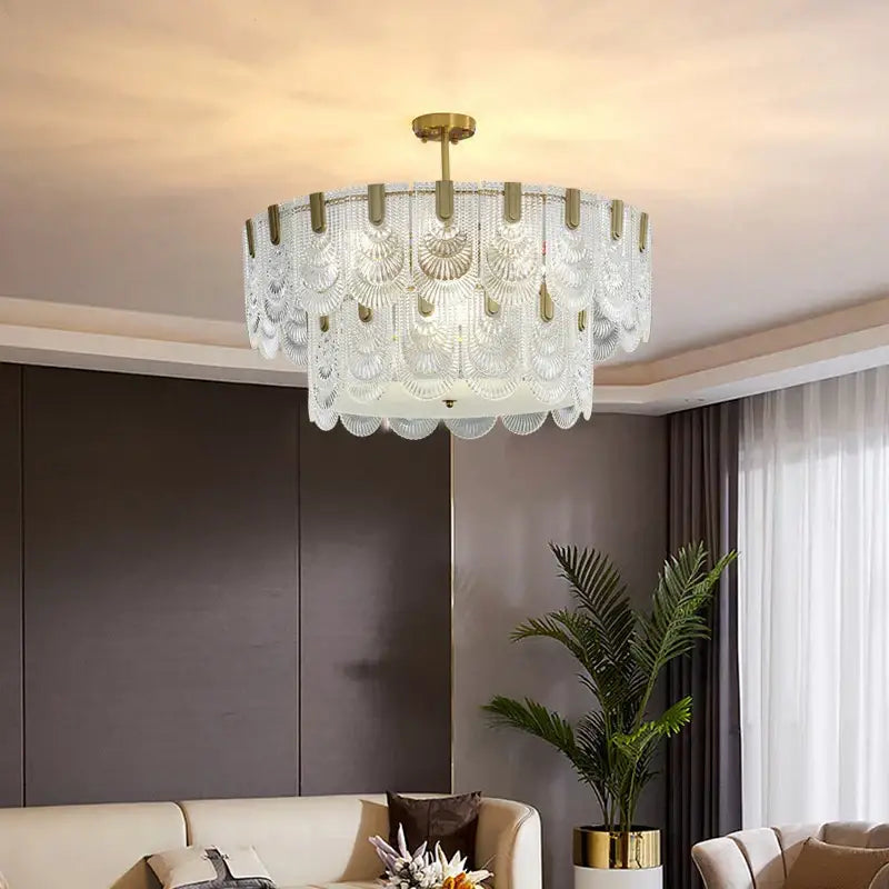 A modern decorbites luxe palace ceiling chandelier with layered translucent glass and gold-toned metal accents