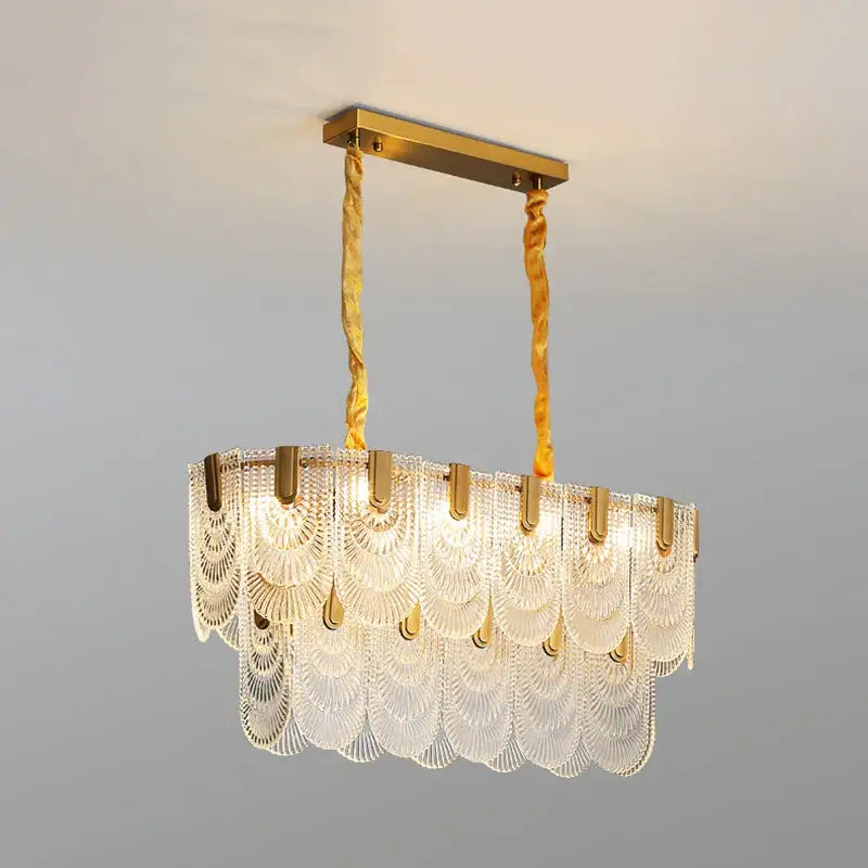Decorbites luxe palace ceiling chandelier with gold-toned metal and cascading clear fan-shaped glass panels suspended by cords