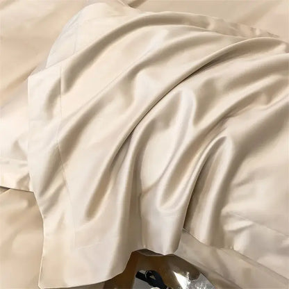 Cream-colored satin pillowcase with smooth glossy finish and soft folds in decorbites™ 1000TC egyptian cotton bedding set with duvet cover and fitted sheet