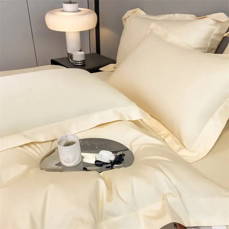 Cream-colored satin duvet cover and fitted sheet from decorbites™ luxurious 1000tc egyptian cotton bedding set with stitched edges