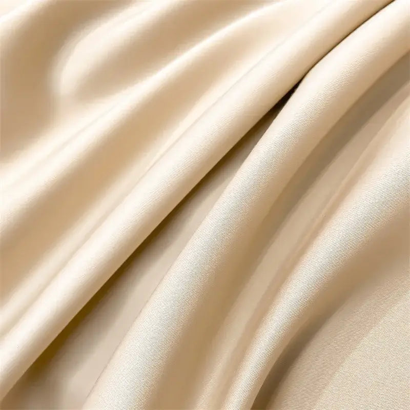 Cream-colored satin duvet cover from the DecorBites™ luxurious 1000TC Egyptian cotton bedding set with glossy finish and gentle folds
