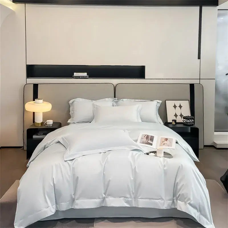 Light blue satin decorbites luxurious 1000TC Egyptian cotton duvet cover set with matching pillowcases on a modern bed