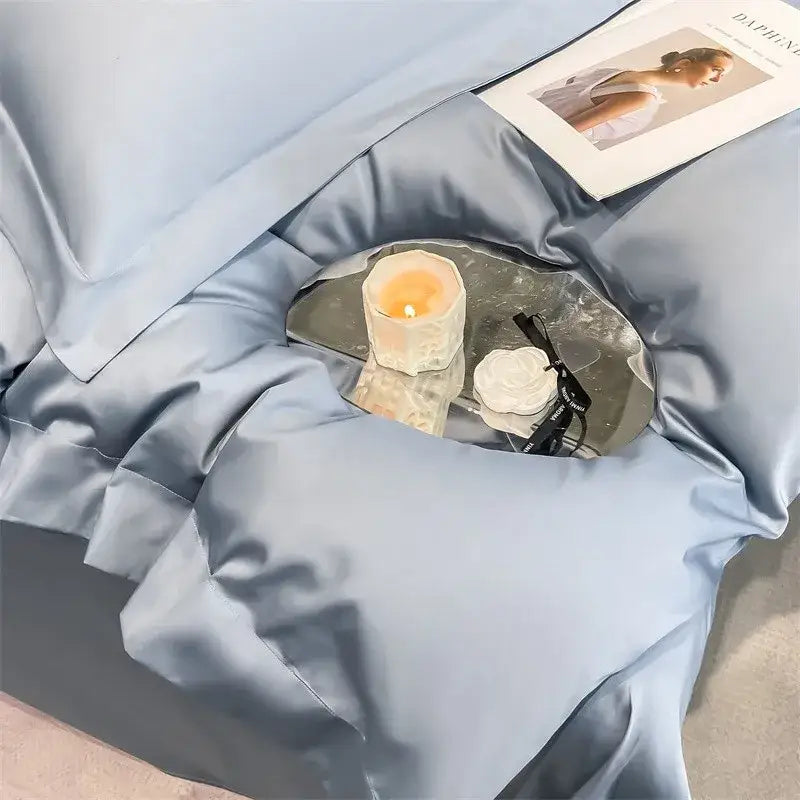 A small mirrored tray with a lit candle and black glasses complements DecorBites luxurious 1000TC cotton duvet cover set