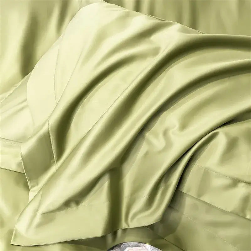 A luxurious sage green satin pillowcase from decorbites™ 1000tc egyptian cotton bedding set featuring smooth folds