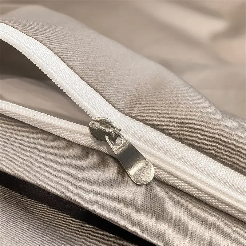 Silver zipper with metallic pull tab on light gray seam of decorbites™ luxurious 1000tc egyptian cotton duvet cover
