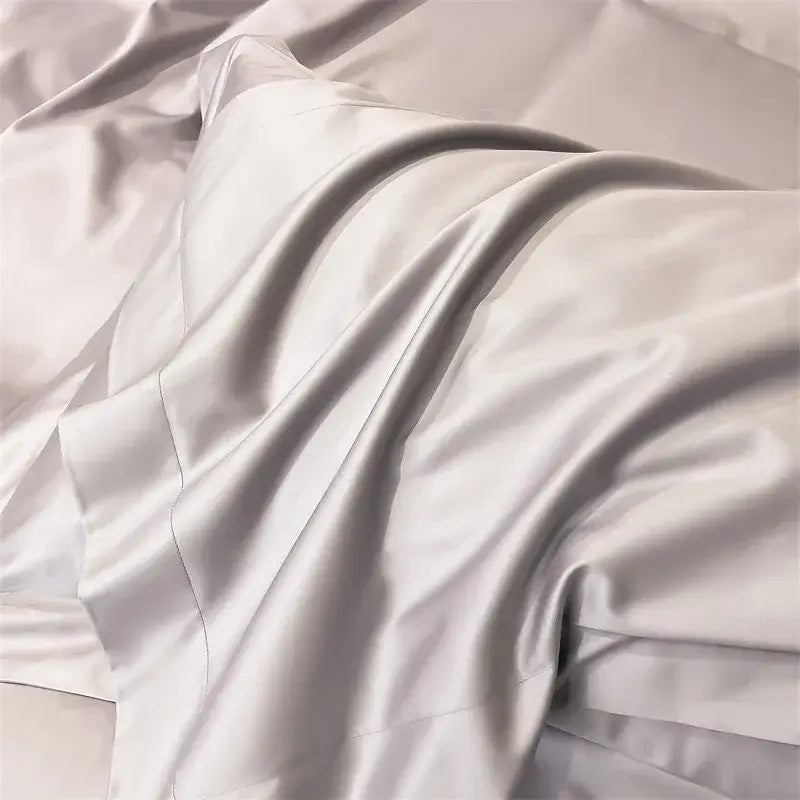 A luxurious silver satin fitted sheet with smooth glossy finish and elegant folds from DecorBites™ 1000TC bedding set