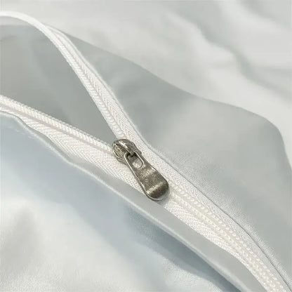 Silver-toned zipper pull on white satin fabric of decorbites™ luxurious 1000tc egyptian cotton duvet cover