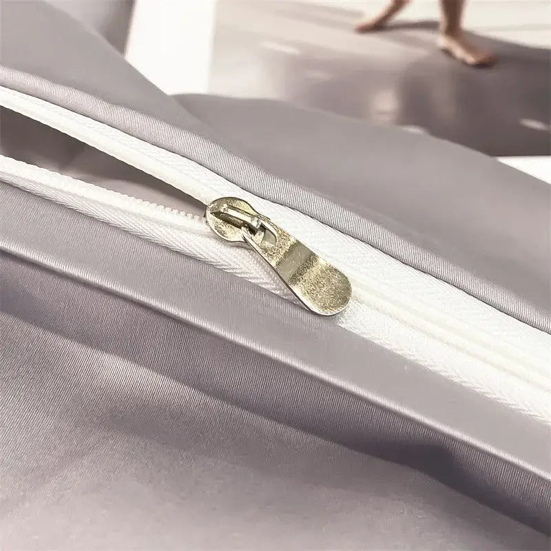 Silver-toned zipper with metallic pull tab on gray fabric of decorbites luxurious 1000tc egyptian cotton duvet cover