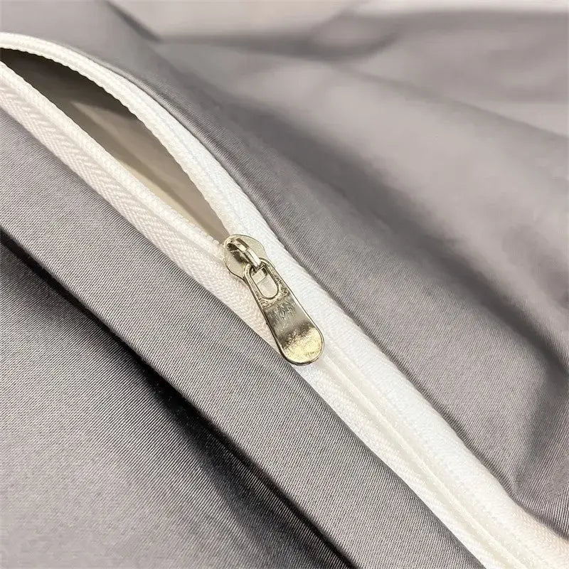 Silver-toned zipper with metallic pull tab on gray fabric of DecorBites™ luxurious 1000TC Egyptian cotton duvet cover