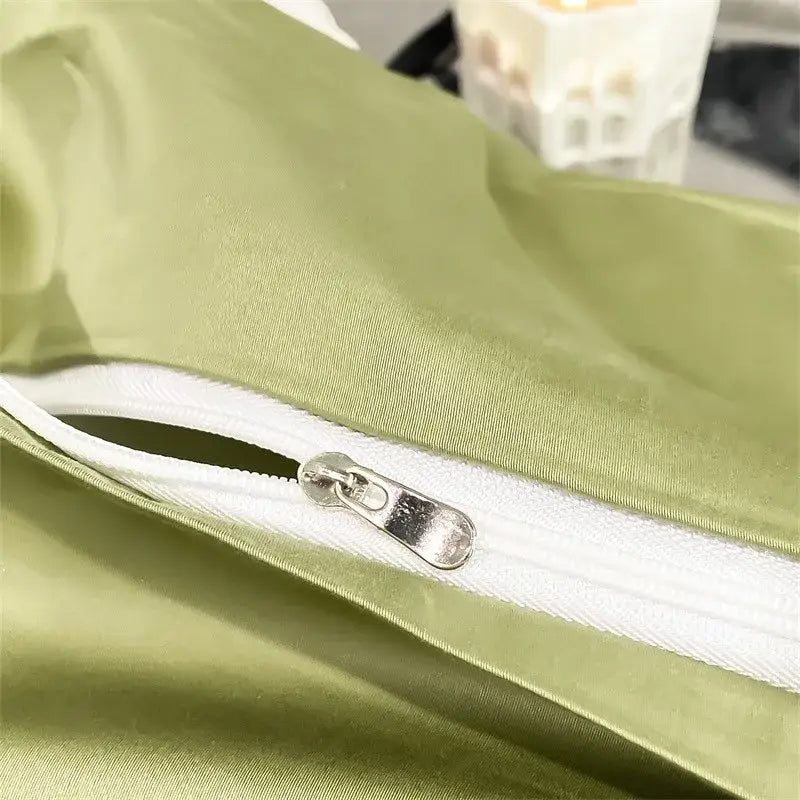 A sleek olive-green satin pillowcase with white zipper and silver pull tab from DecorBites™ 1000TC bedding set