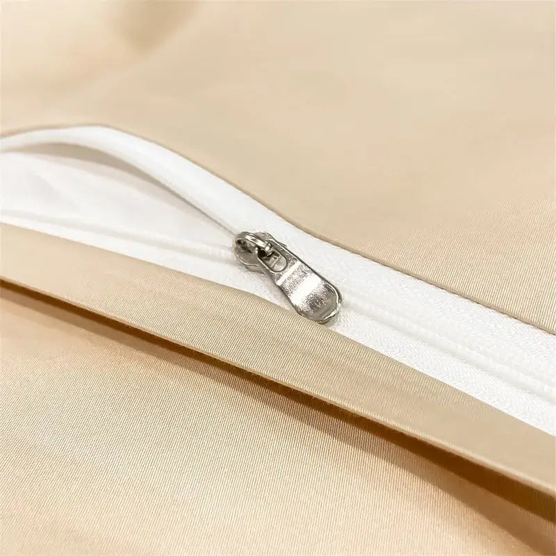 A sleek silver zipper on the beige satin pillowcase of decorbites™ luxurious 1000tc egyptian cotton duvet cover