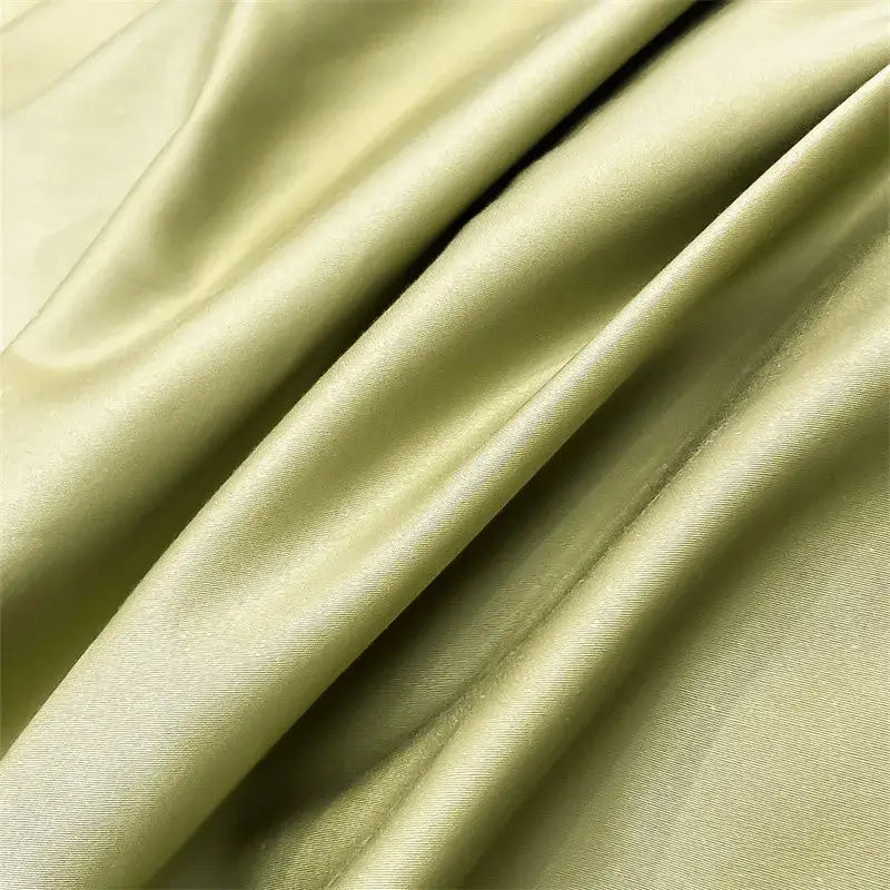 DecorBites™ luxurious 1000TC Egyptian cotton fitted sheet in soft olive green satin-like fabric with subtle sheen and folds